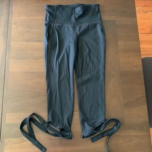 Black Gap 3/4 length leggings, with tie feather at bottom, size small